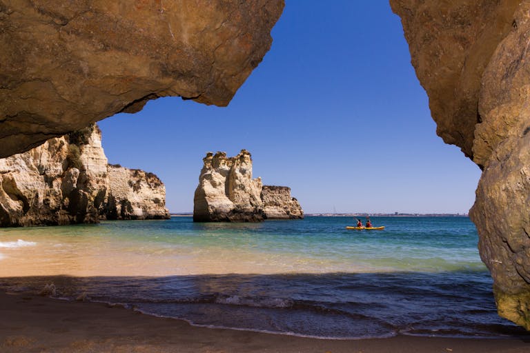 Explore the stunning rock formations and clear waters of Lagos, Portugal, by kayak.