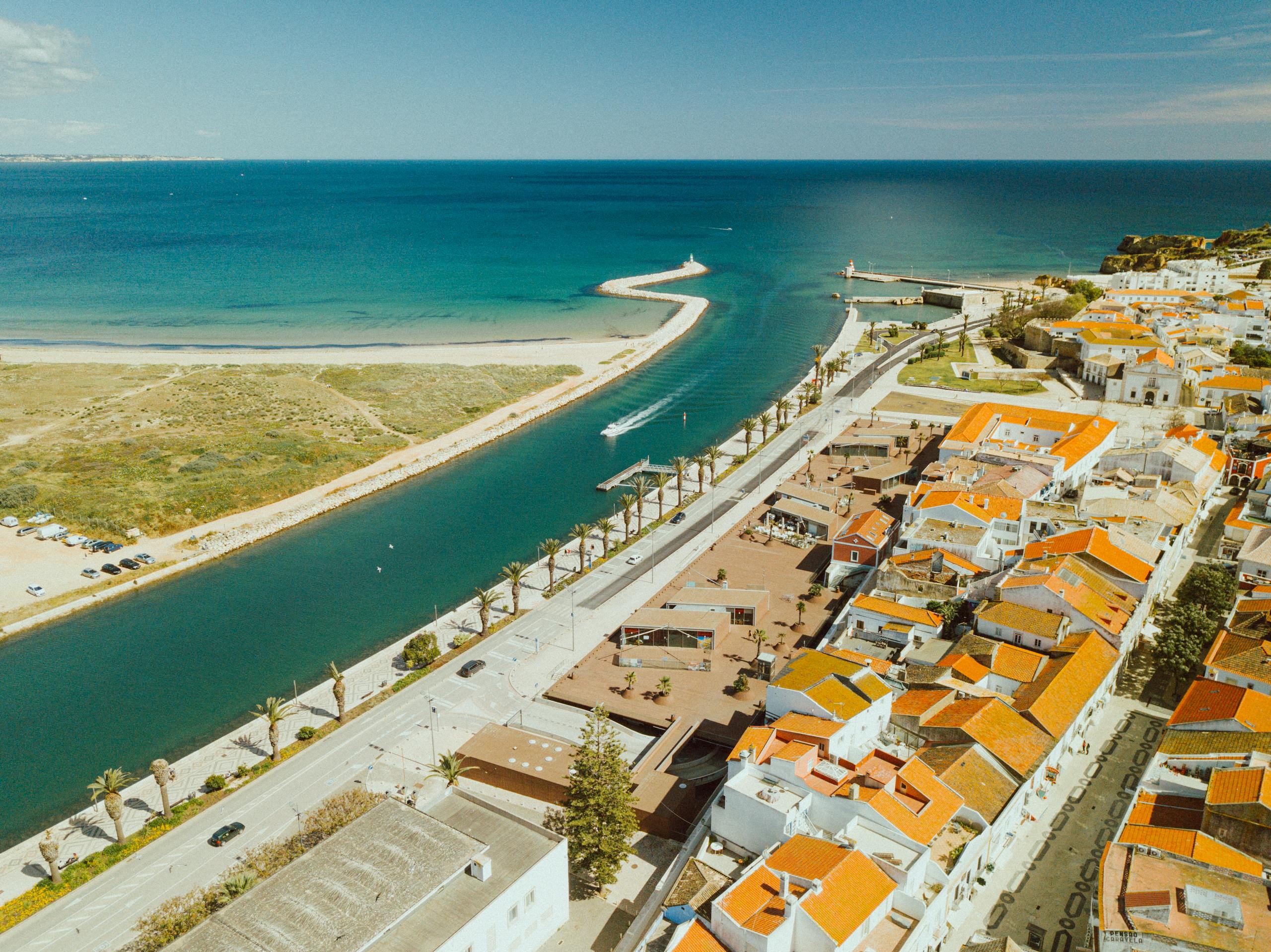 Stunning aerial view of Lagos in the Faro District, showcasing beautiful coastline and architecture.